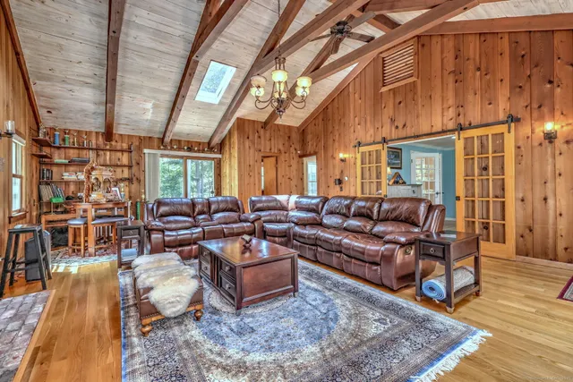 a living room with lots of furniture and a rug