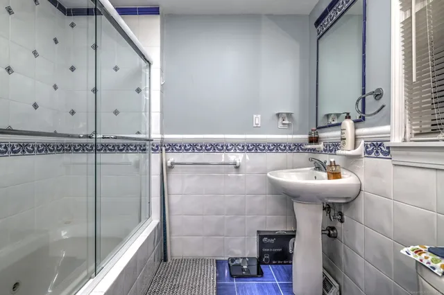 a bathroom with a sink and mirror