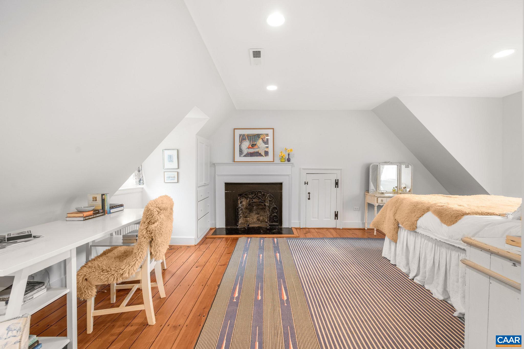 1985 Stony Point Road Charlottesville, VA 22911 - Photo 34 of 62 a spacious bedroom with a bed and a fireplace