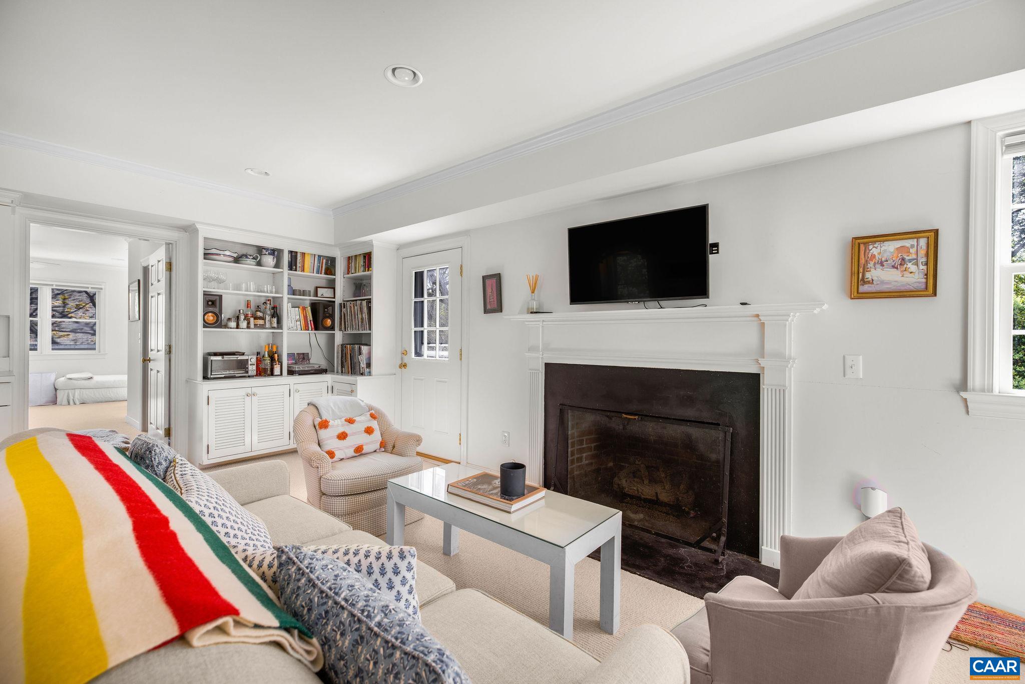 1985 Stony Point Road Charlottesville, VA 22911 - Photo 52 of 62 a living room with furniture a flat screen tv and a fireplace