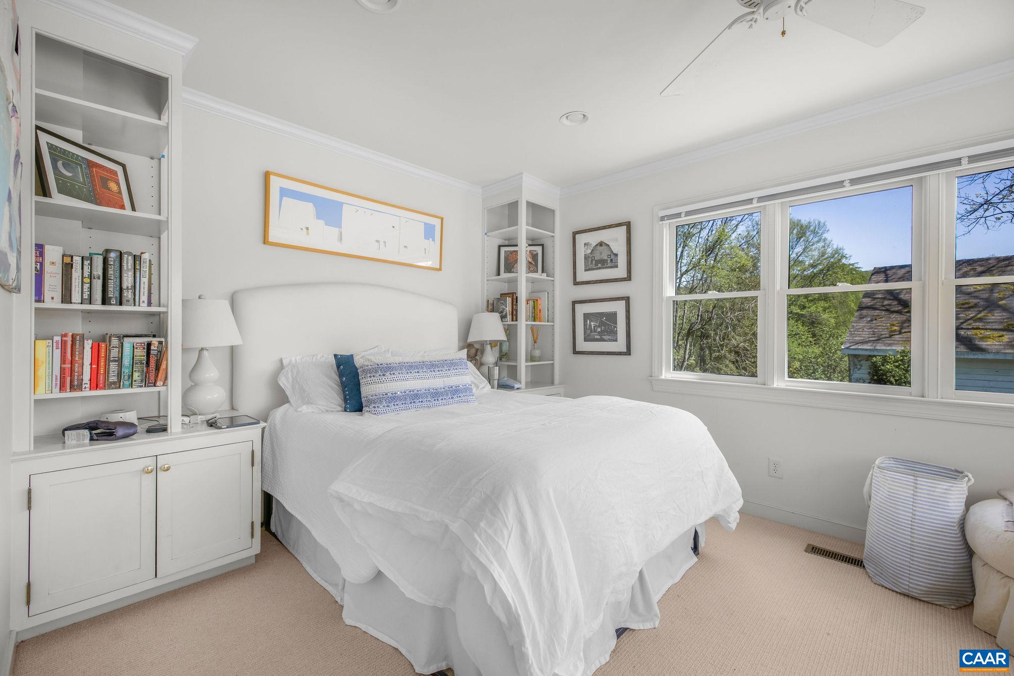 1985 Stony Point Road Charlottesville, VA 22911 - Photo 54 of 62 a bedroom with a bed cabinets and a window
