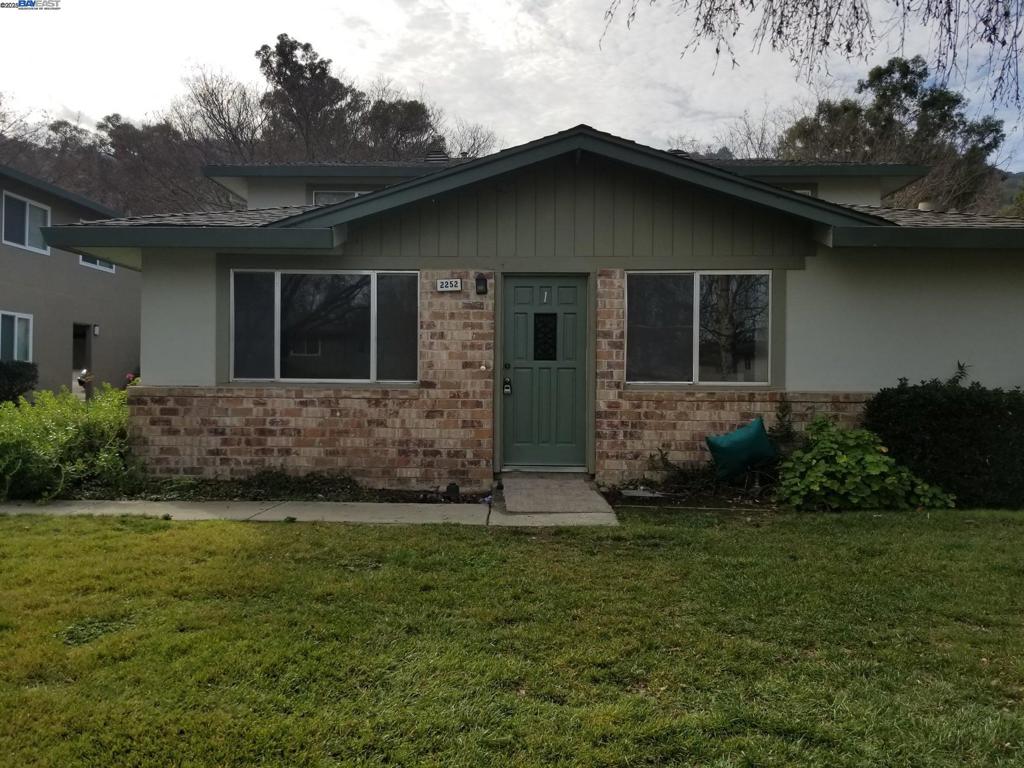 Undisclosed Address Pleasanton, CA 94588 - Photo 1 of 17 a front view of a house with a yard
