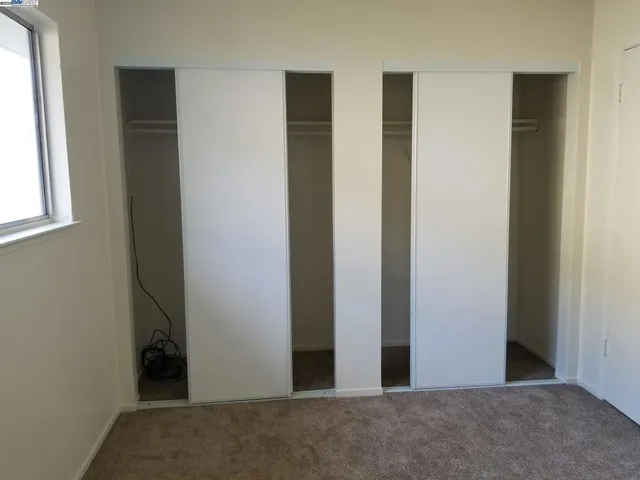 a view of backyard with swimming pool and patio