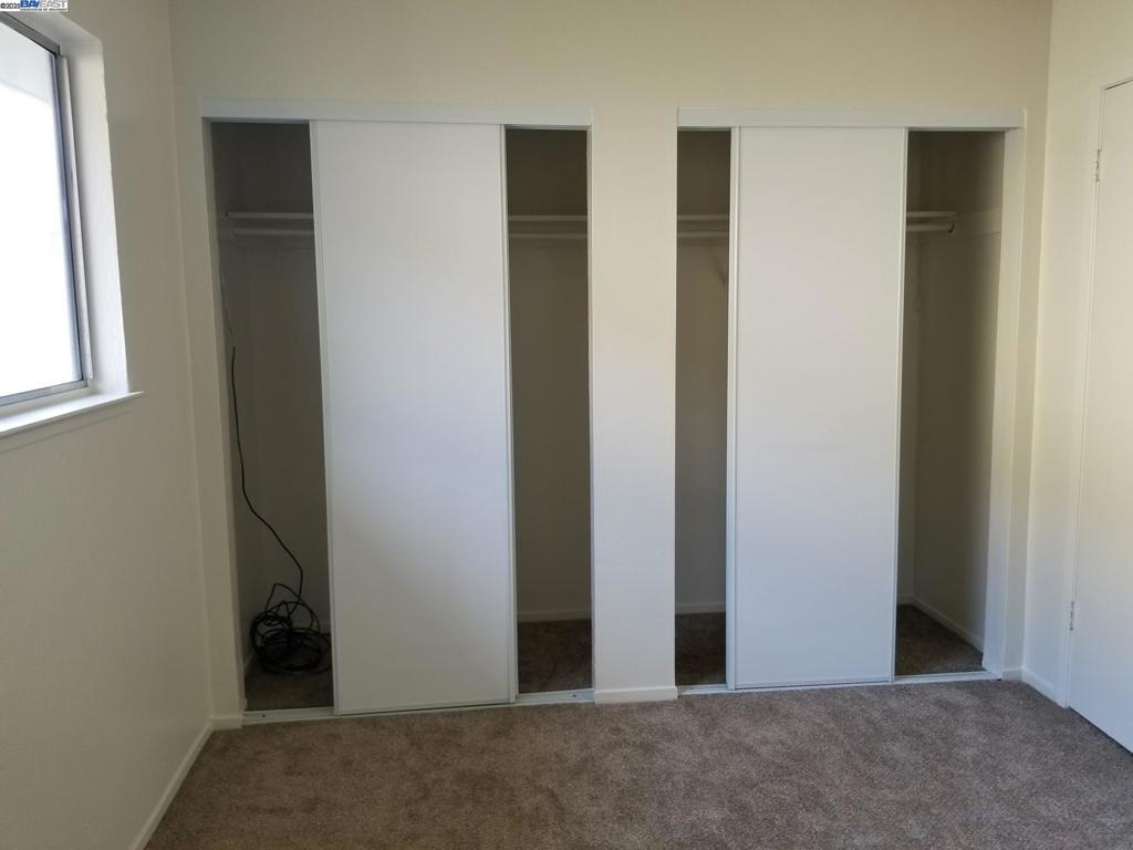 Undisclosed Address Pleasanton, CA 94588 - Photo 11 of 17 an empty room with windows