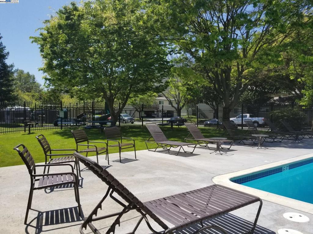 Undisclosed Address Pleasanton, CA 94588 - Photo 17 of 17 a view of swimming pool with chairs