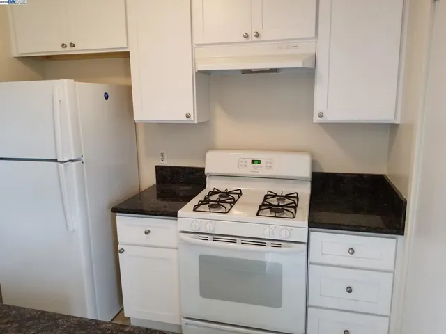 a kitchen with sink and washing machine