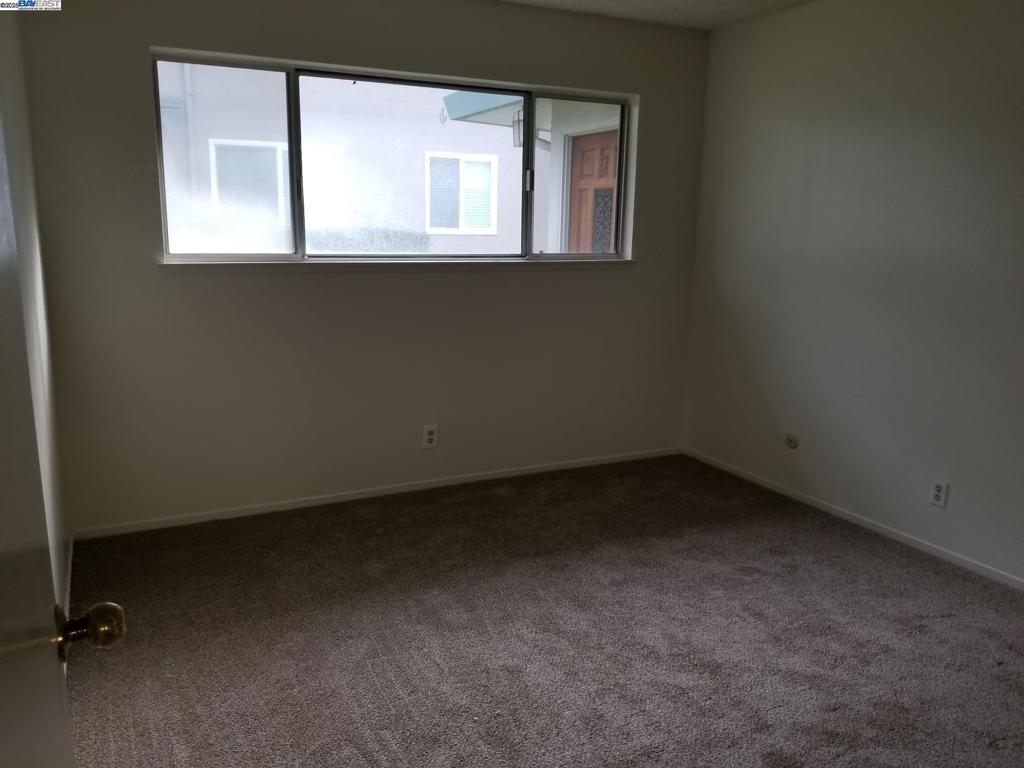 Undisclosed Address Pleasanton, CA 94588 - Photo 7 of 17 an empty room with a window