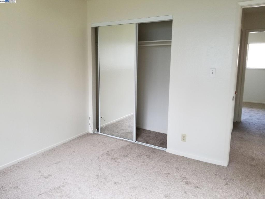Undisclosed Address Pleasanton, CA 94588 - Photo 8 of 17 an empty room with closet