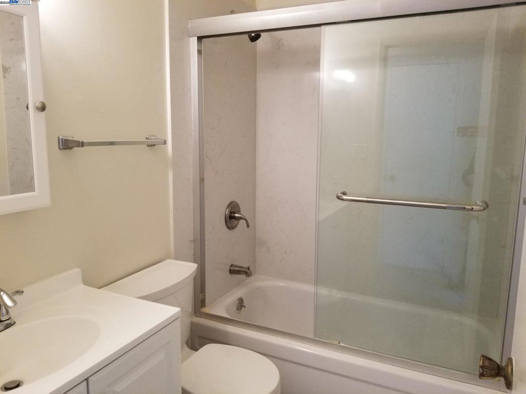 Undisclosed Address Pleasanton, CA 94588 - Photo 9 of 17 a bathroom with a sink and a mirror