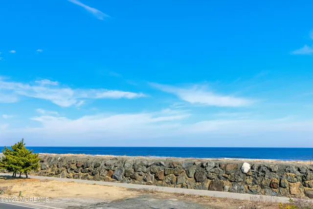 a view of a house with a snow on the road