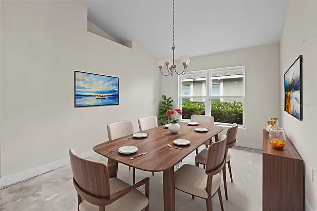 a view of a dining room with furniture window and outside view