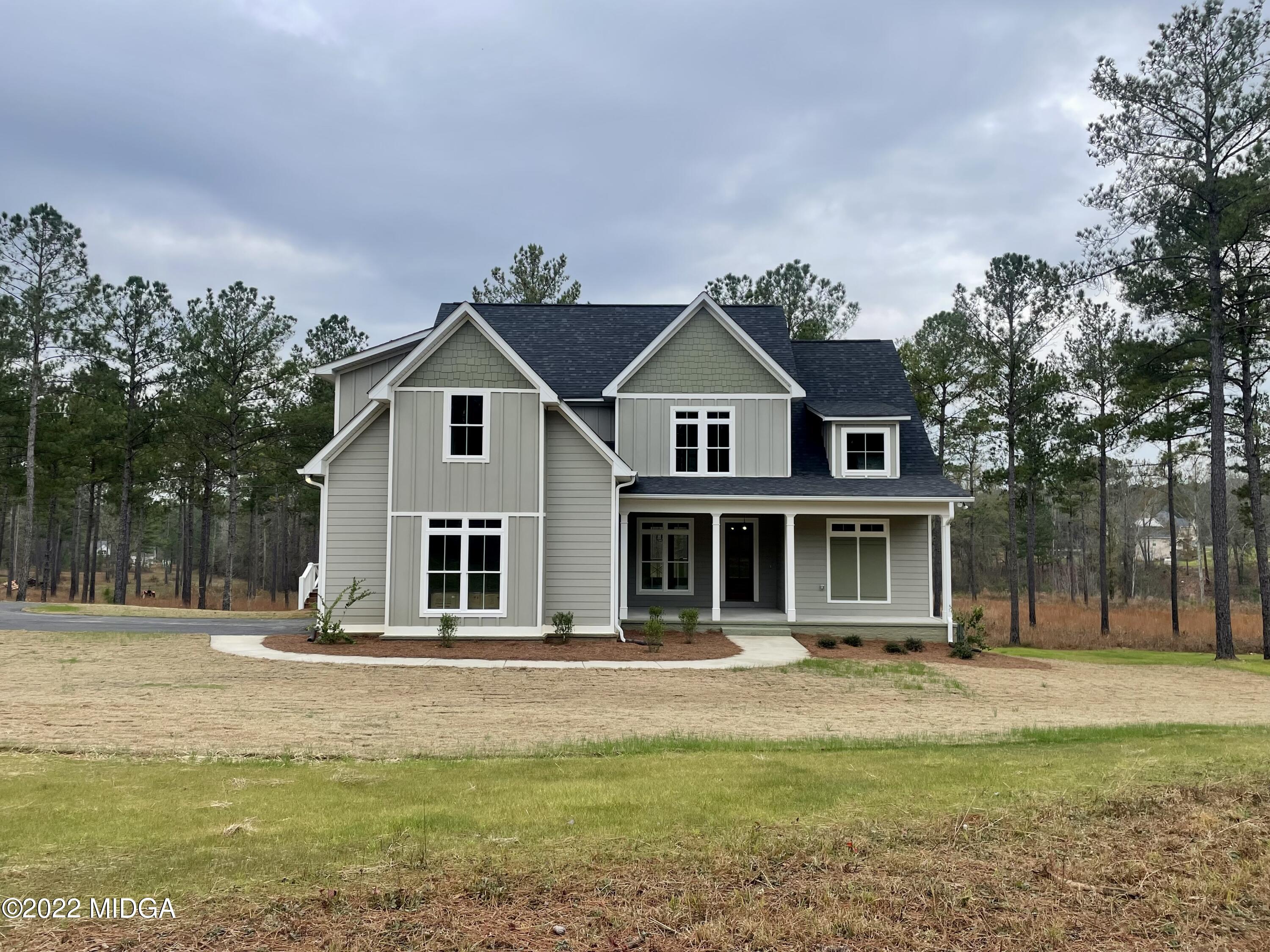 687 Edge Road Forsyth, GA 31029 - Photo 1 of 16 a front view of a house with a yard