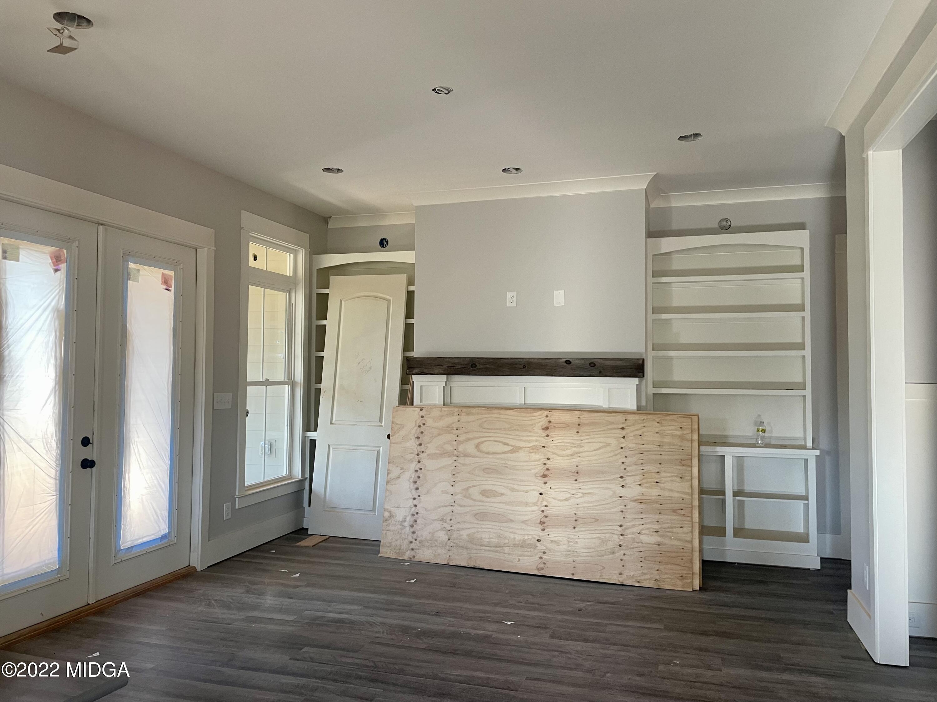 687 Edge Road Forsyth, GA 31029 - Photo 3 of 16 a view of walk in closet with empty racks