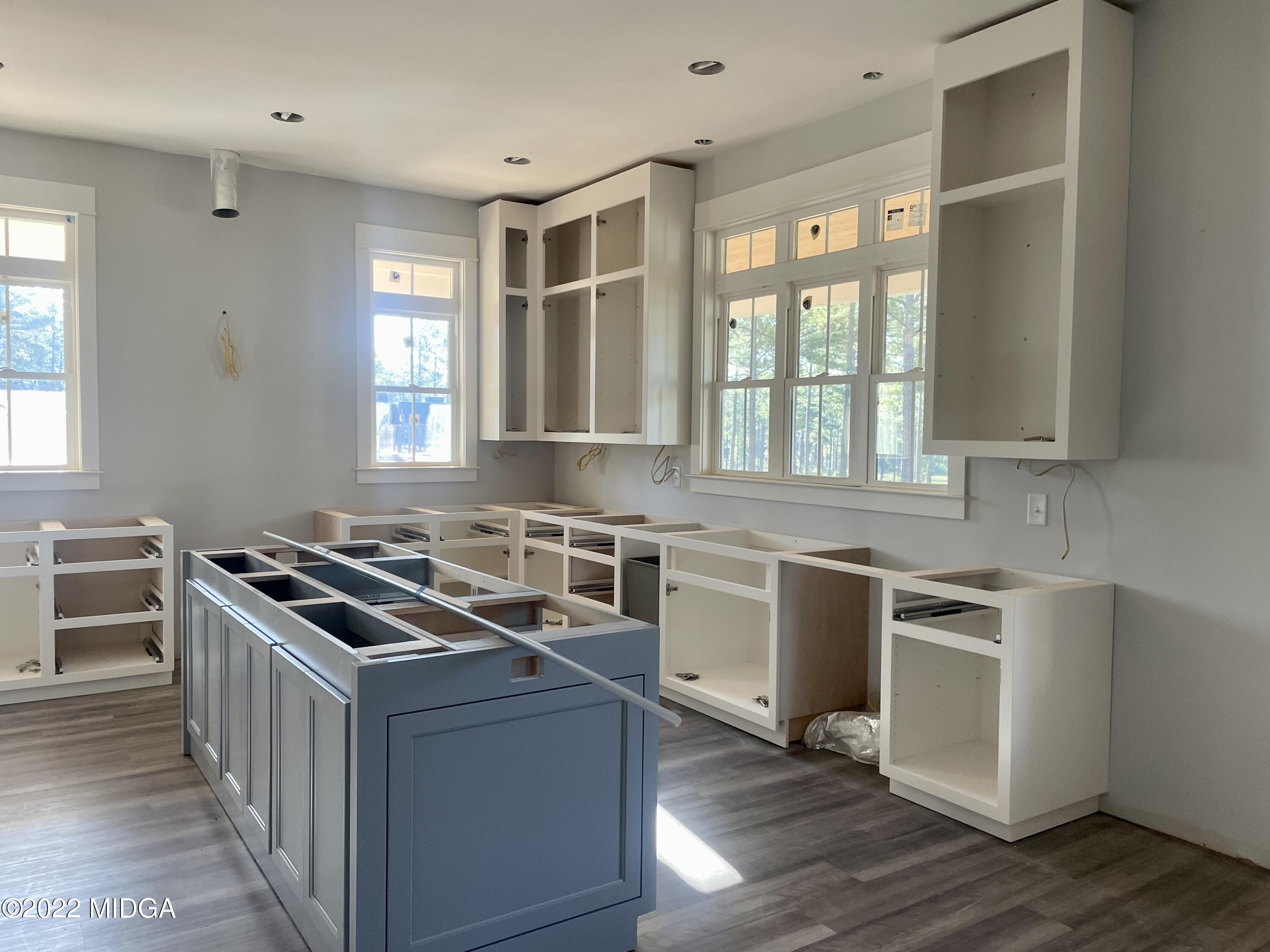 687 Edge Road Forsyth, GA 31029 - Photo 4 of 16 a kitchen with stainless steel appliances granite countertop a stove and a sink
