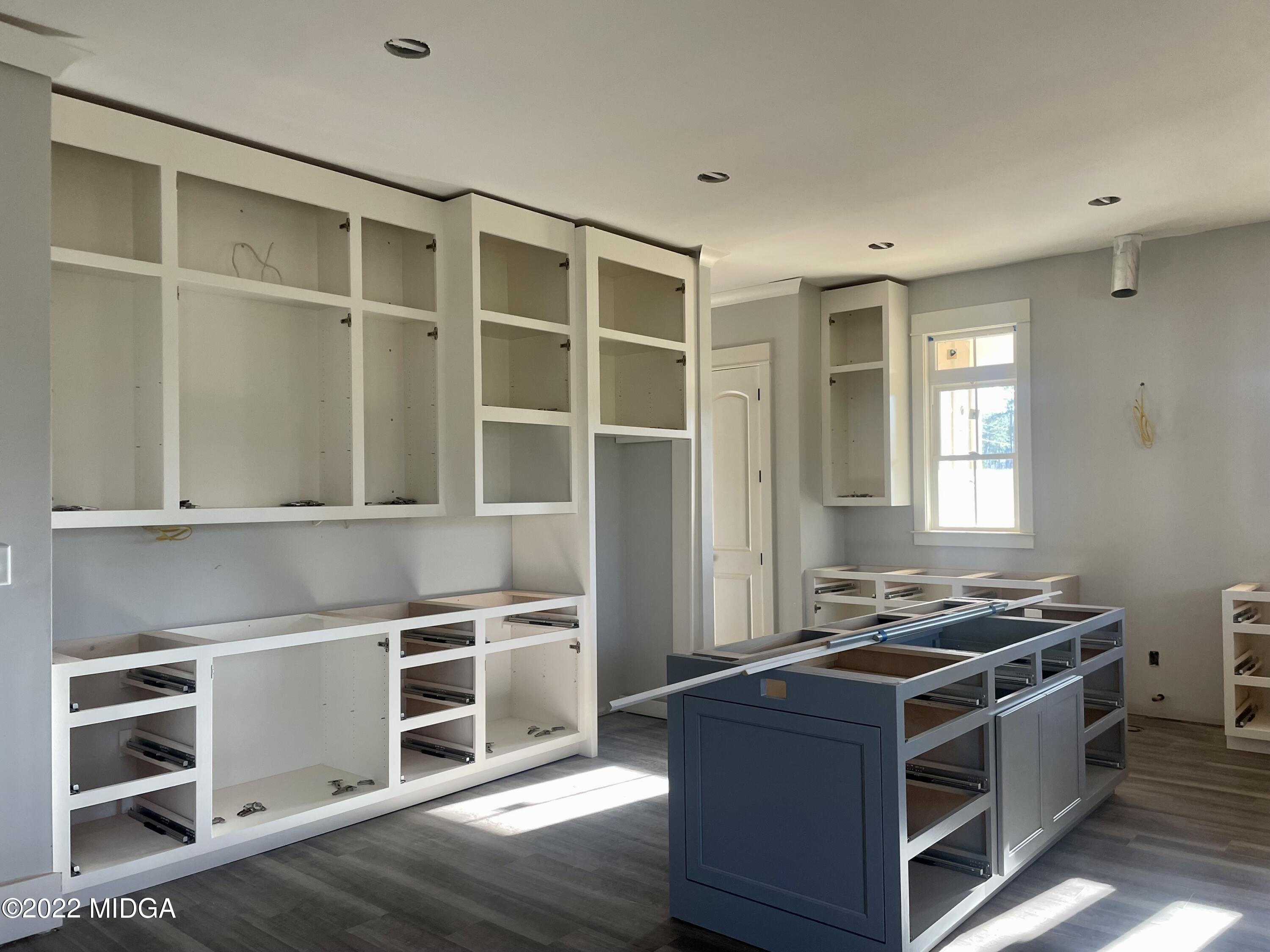 687 Edge Road Forsyth, GA 31029 - Photo 5 of 16 a kitchen with a stove and a cabinet