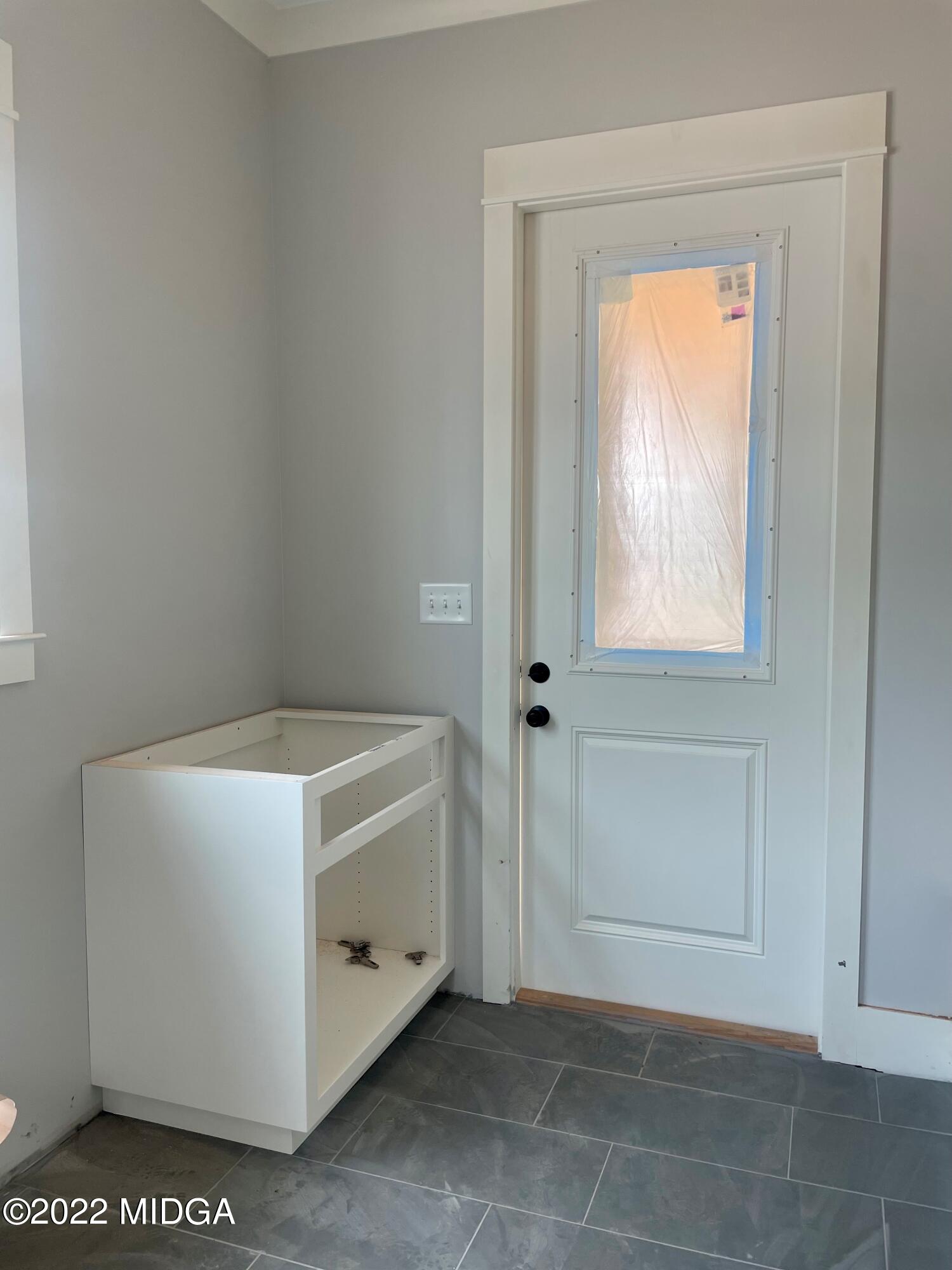 687 Edge Road Forsyth, GA 31029 - Photo 8 of 16 a utility room with washer and dryer