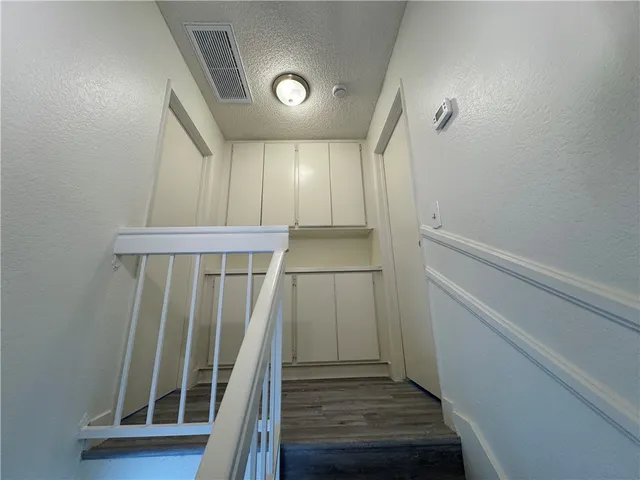 a bathroom with a double vanity sink toilet and shower
