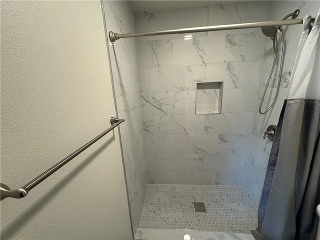 a view of a refrigerator with wooden floor