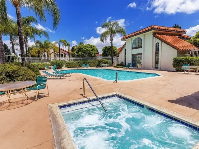 an aerial view of a house with a yard and potted plants