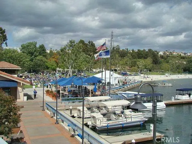 a swimming pool with outdoor seating and yard