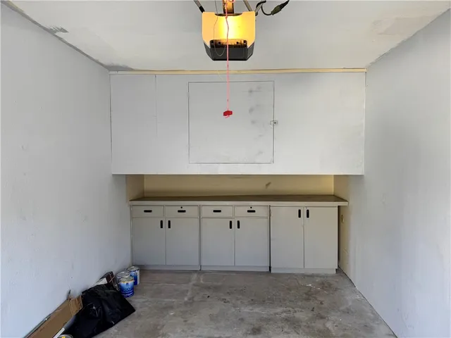 a kitchen with a sink stove and refrigerator