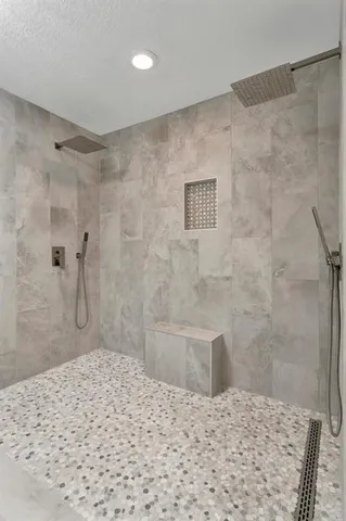 a white bath tub sitting in a bathroom