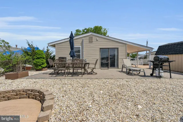a house view with a sitting space and garden space
