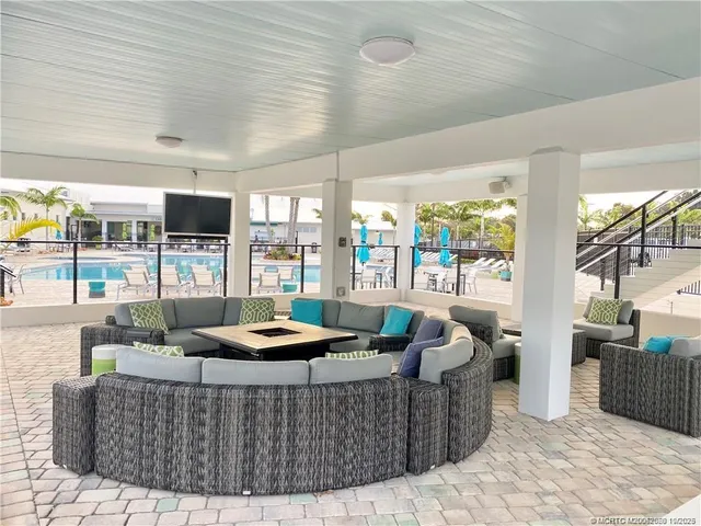 a view of a dinning table and chairs in patio