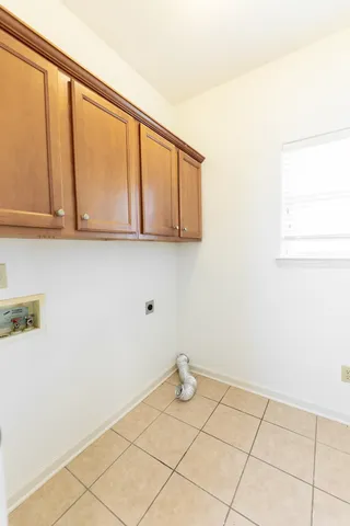 a view of an empty room and wooden floor