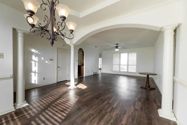 a view of livingroom and kitchen with wooden floor