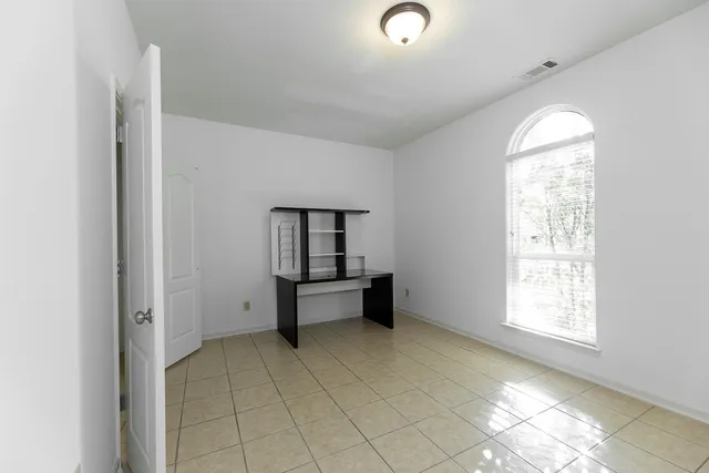 an empty room with windows