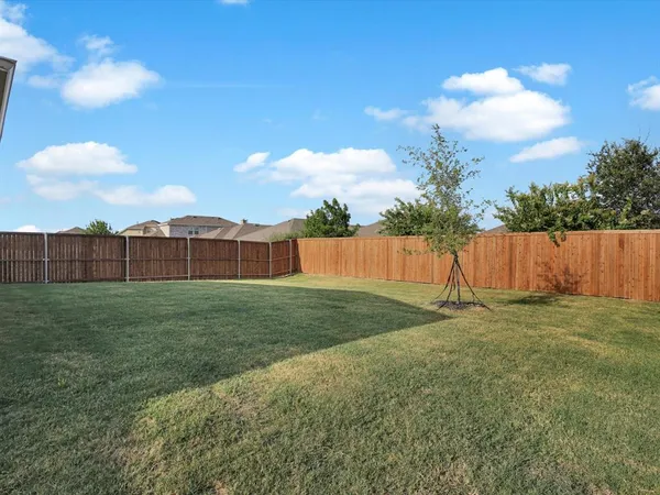 a backyard of a house with lots of green space