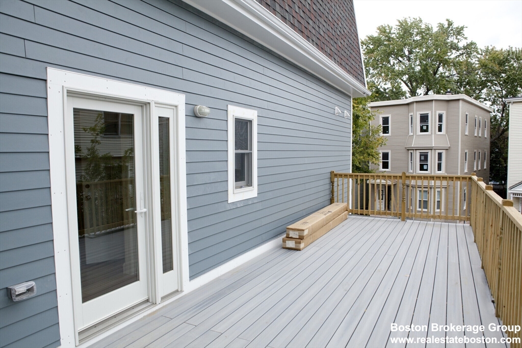 35 Forbes Street, Unit 2 Boston, MA 02130 - Photo 11 of 11 a view of a house with a wooden deck