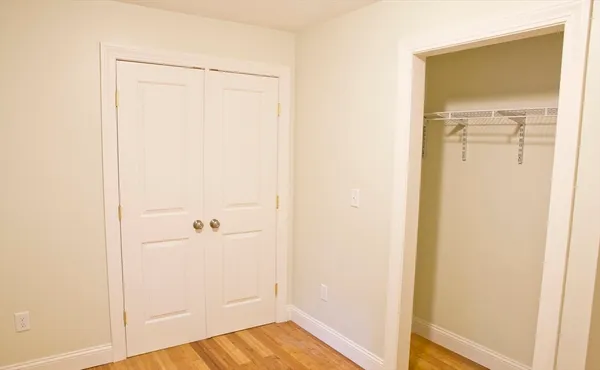 a view of a small space with wooden floor