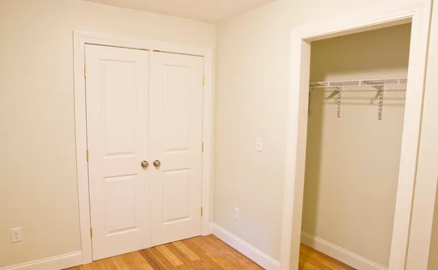 a view of a small space with wooden floor