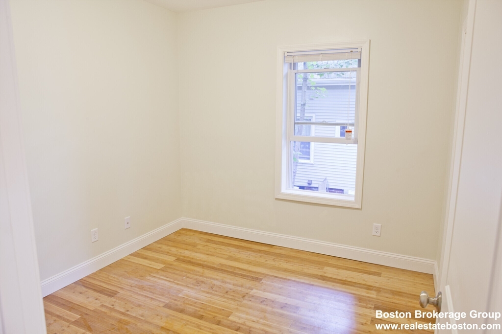 35 Forbes Street, Unit 2 Boston, MA 02130 - Photo 7 of 11 a view of empty room with wooden floor