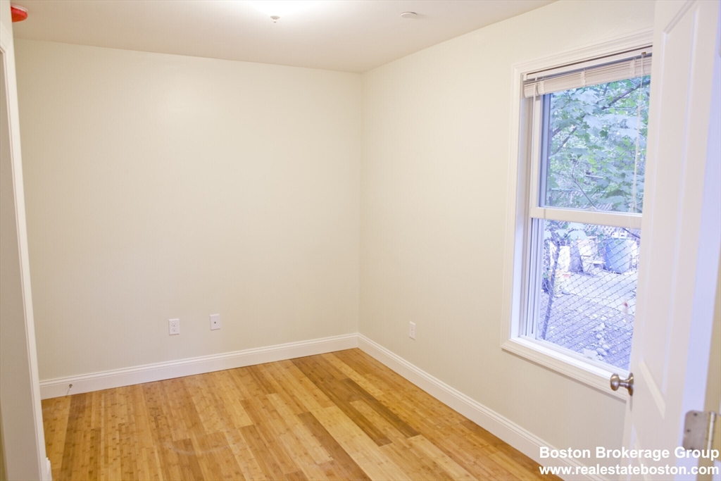 35 Forbes Street, Unit 2 Boston, MA 02130 - Photo 8 of 11 a view of small space with wooden floor and a window