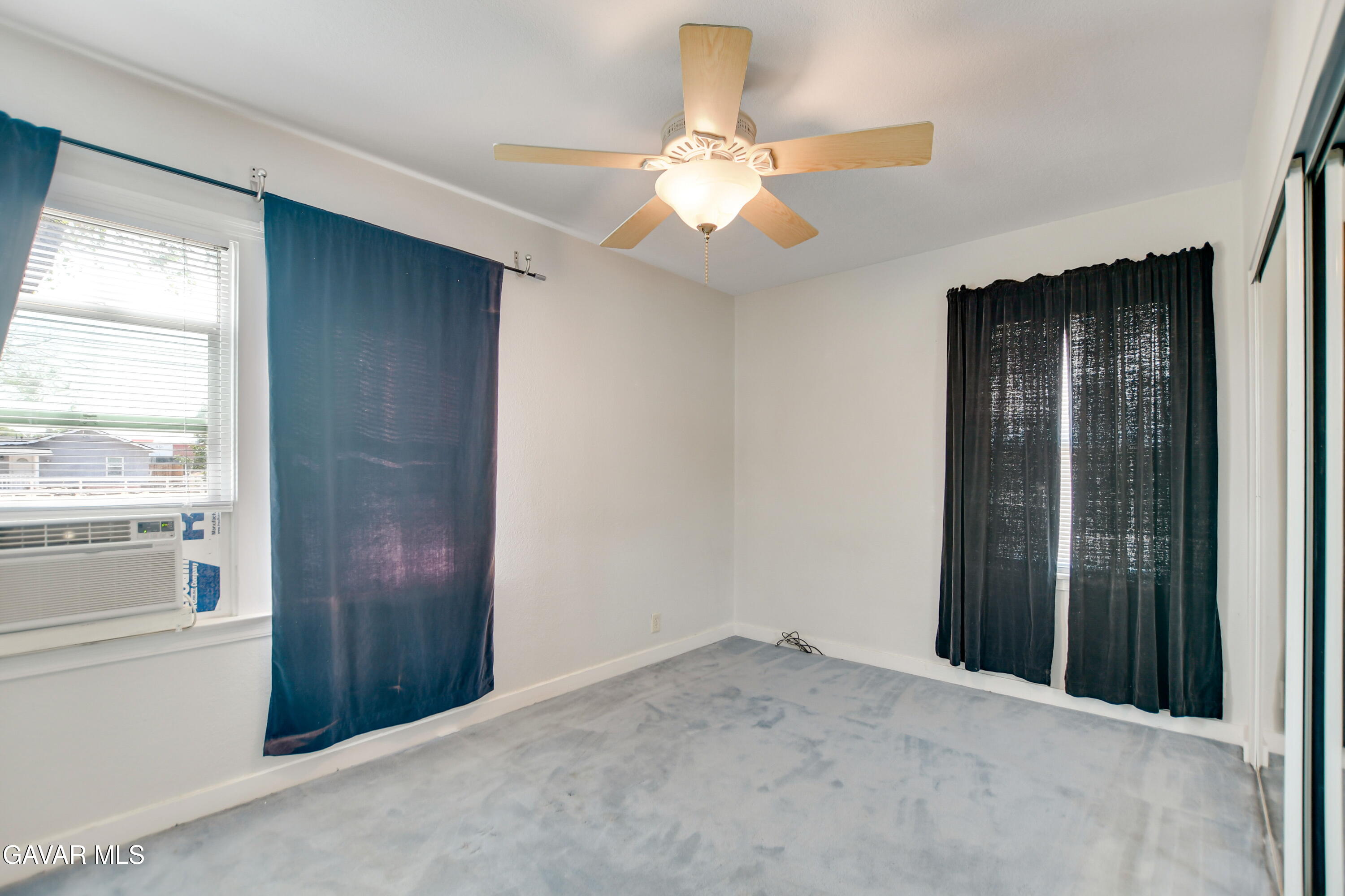 43517 7th Street East Lancaster, CA 93535 - Photo 16 of 47 an empty room with closet and windows