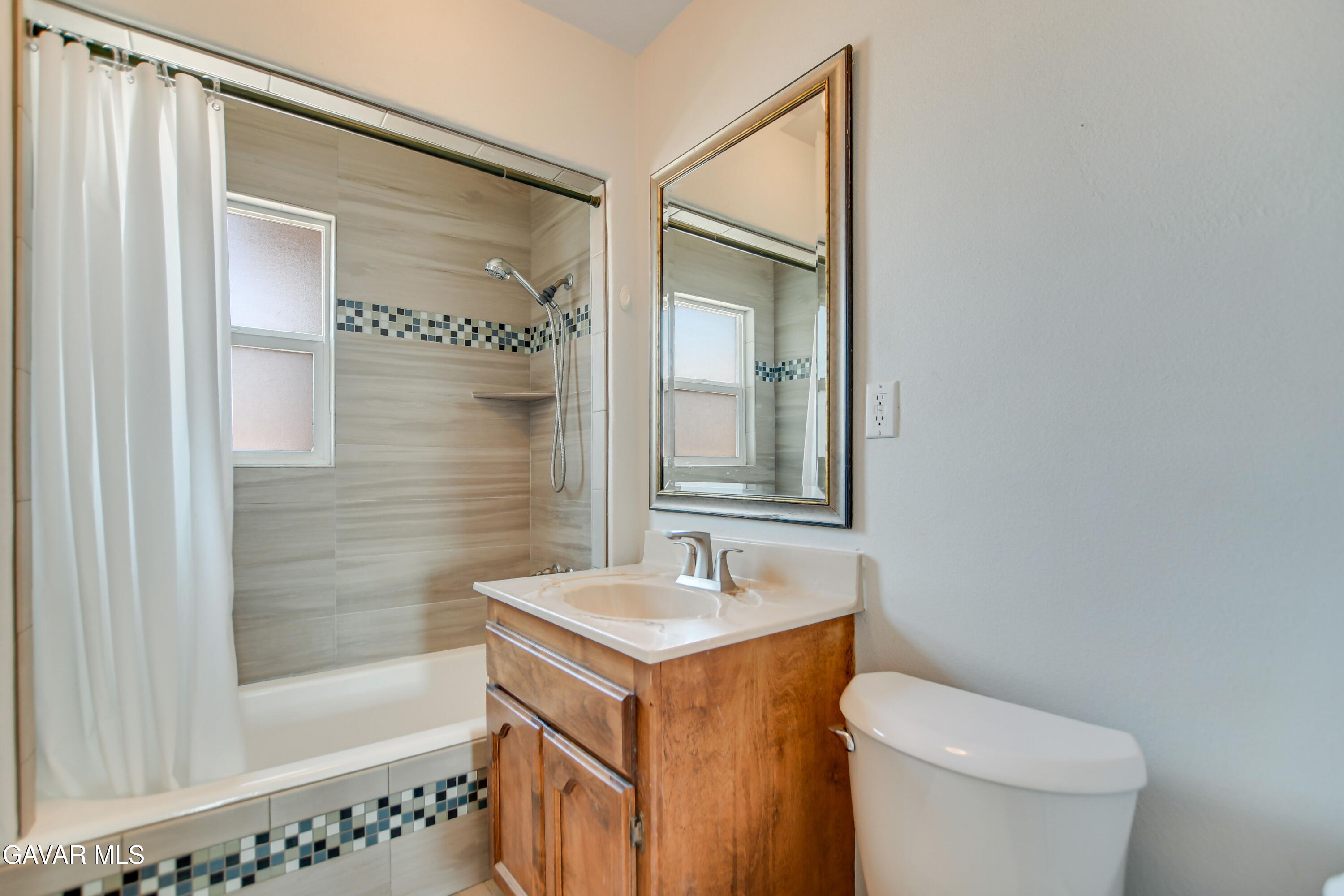 43517 7th Street East Lancaster, CA 93535 - Photo 18 of 47 a bathroom with a sink a toilet and shower