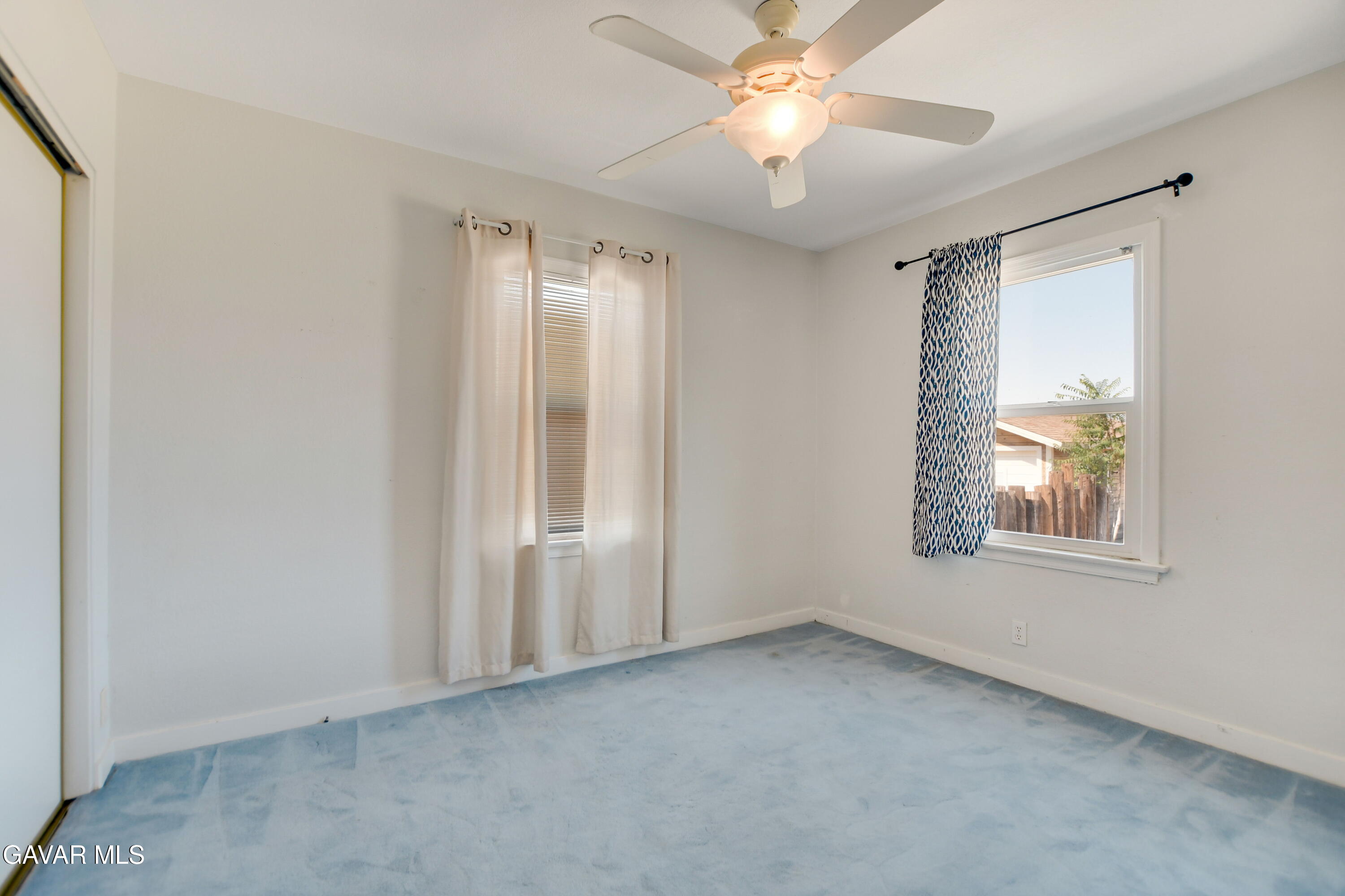 43517 7th Street East Lancaster, CA 93535 - Photo 20 of 47 an empty room with windows and fan