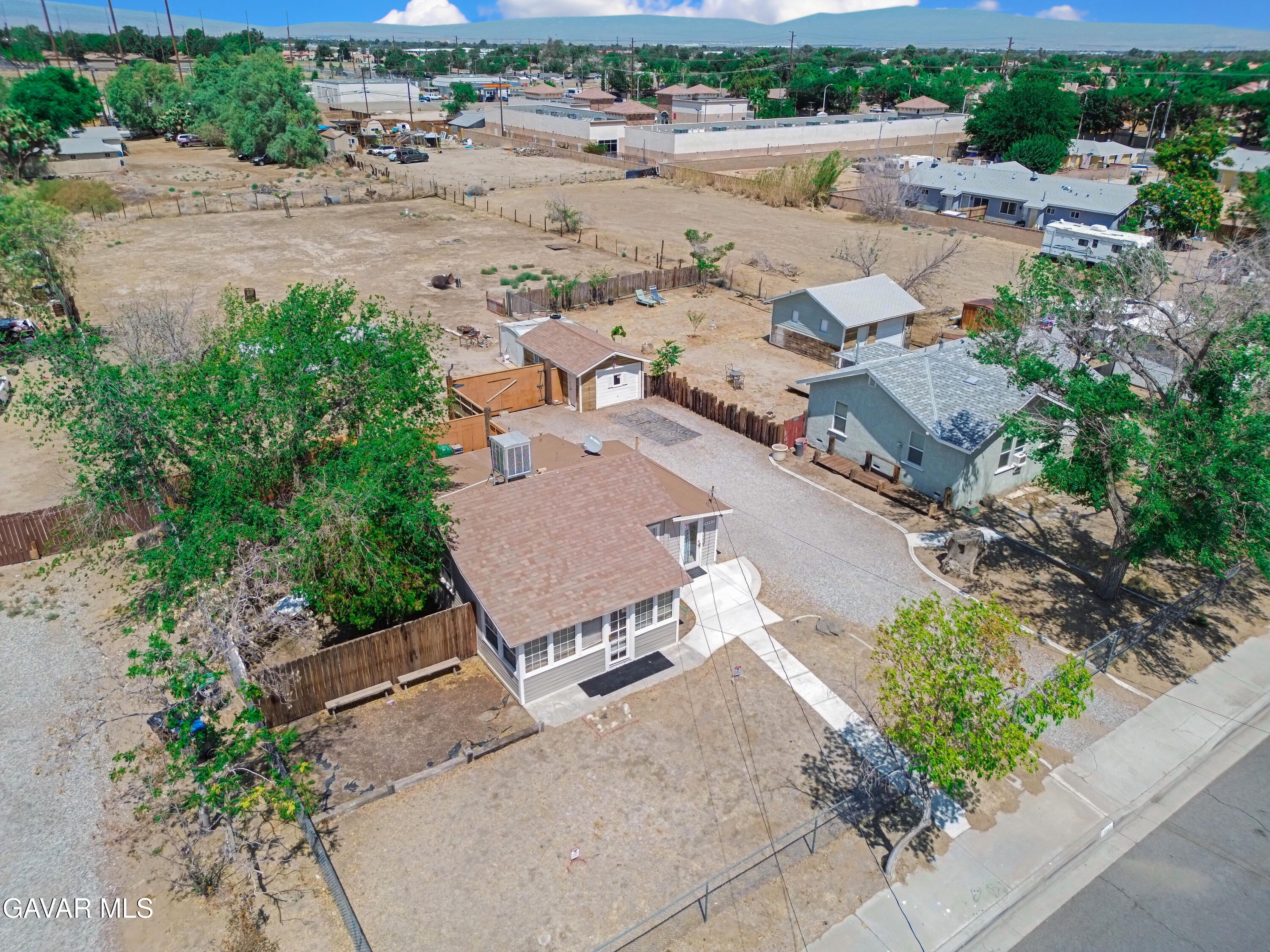 43517 7th Street East Lancaster, CA 93535 - Photo 2 of 47 an aerial view of a house with a yard and outdoor seating