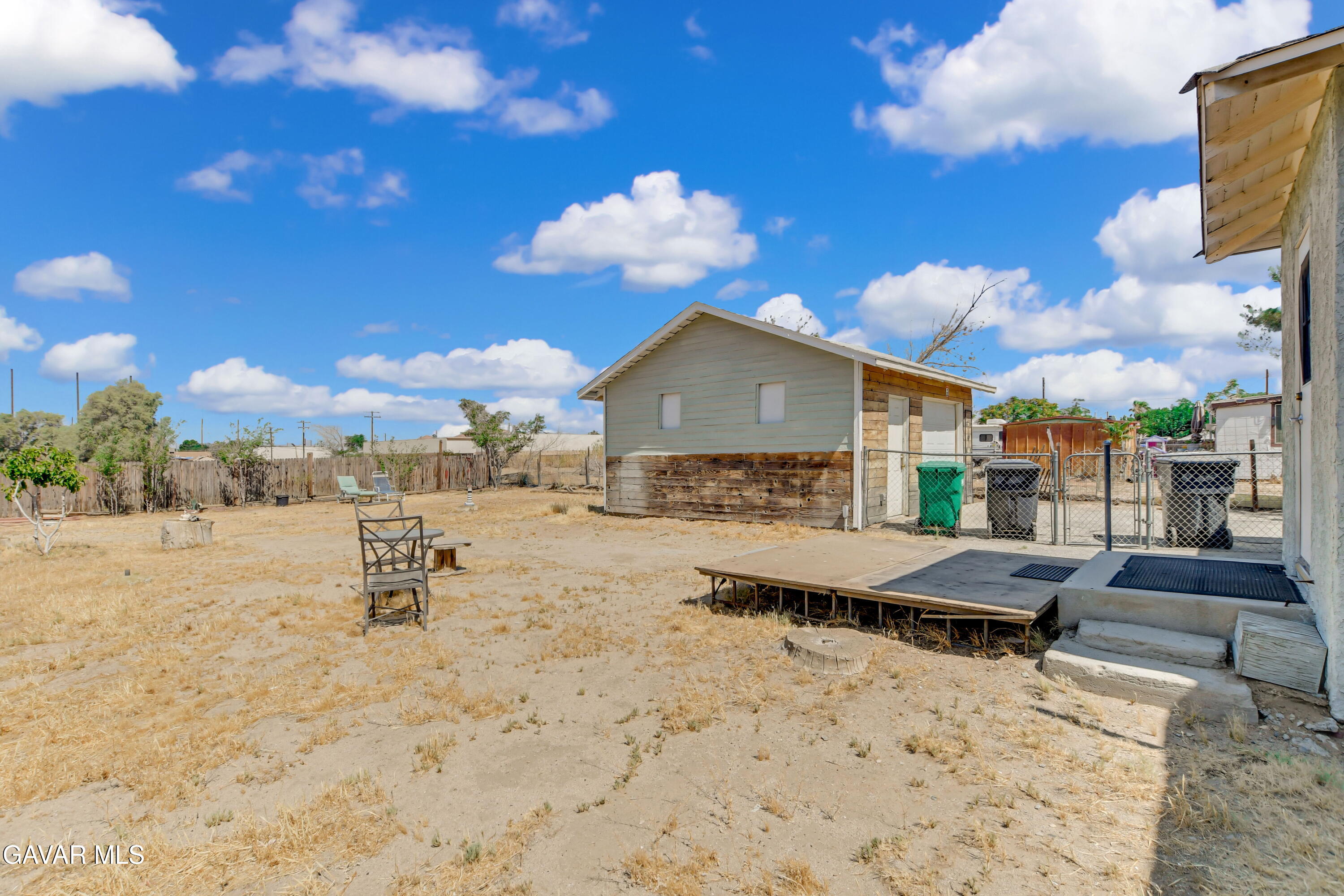 43517 7th Street East Lancaster, CA 93535 - Photo 22 of 47 a view of a terrace with lawn chairs