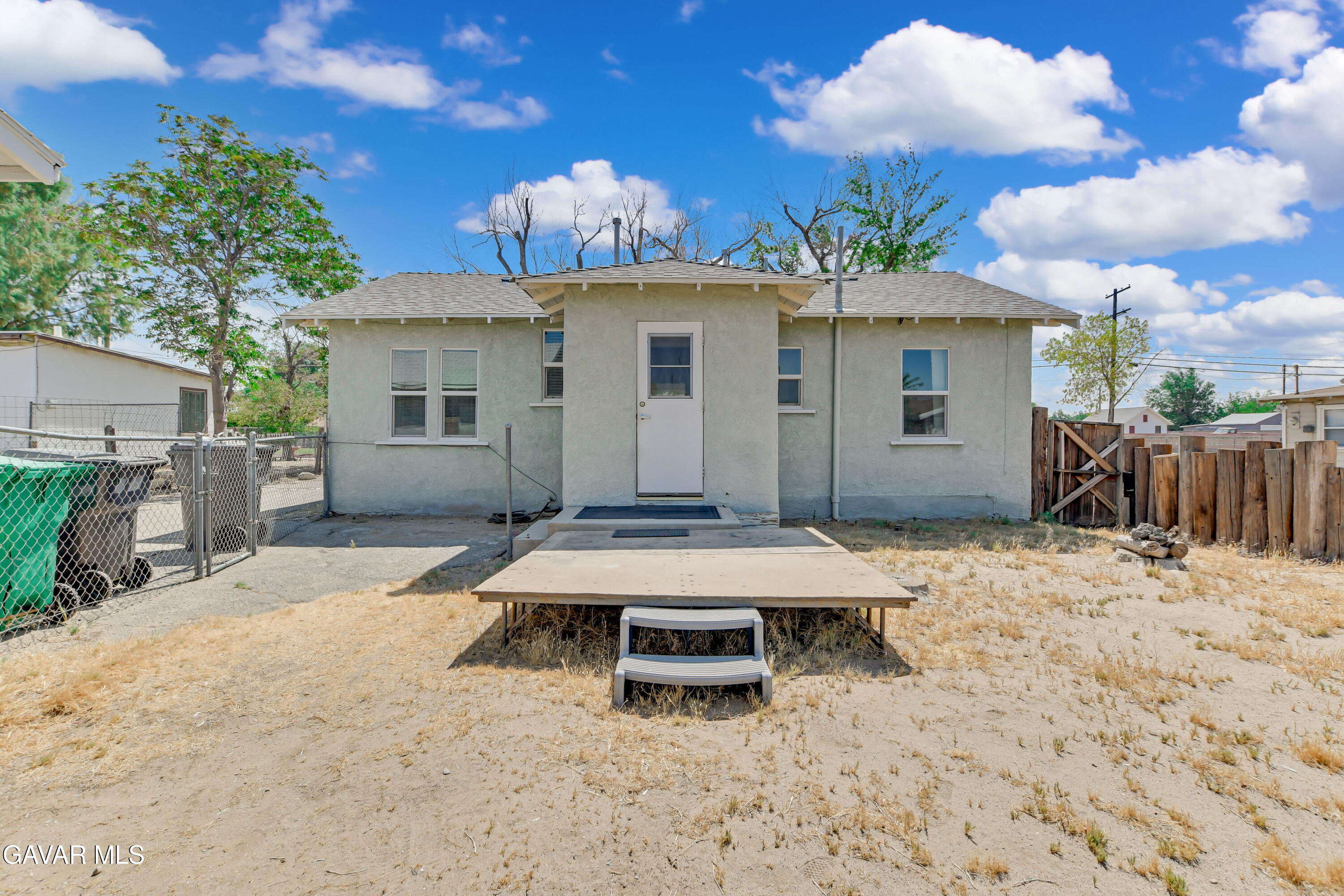 43517 7th Street East Lancaster, CA 93535 - Photo 23 of 47 a view of a house with a wooden roof and a window