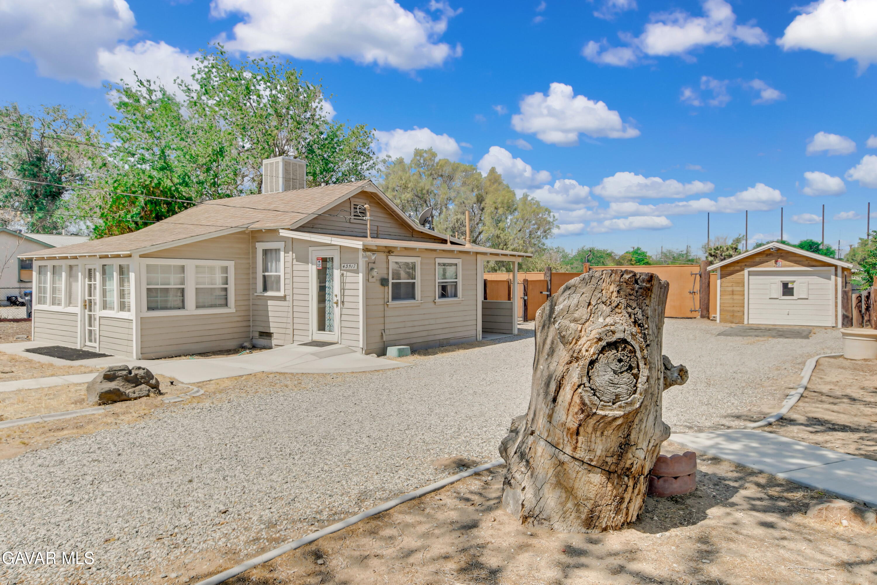 43517 7th Street East Lancaster, CA 93535 - Photo 25 of 47 a front view of a house with garden