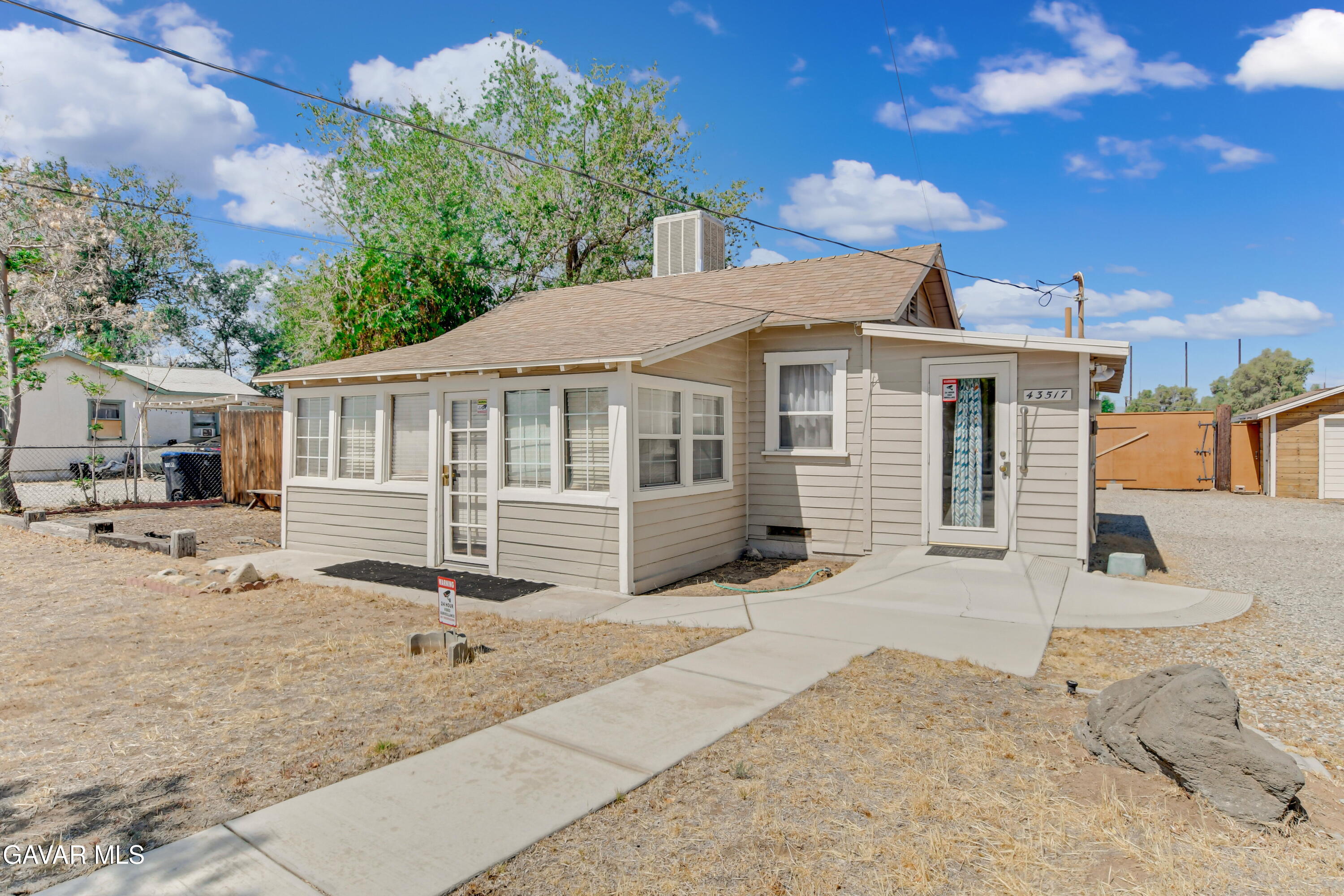 43517 7th Street East Lancaster, CA 93535 - Photo 27 of 47 a front view of a house with a patio
