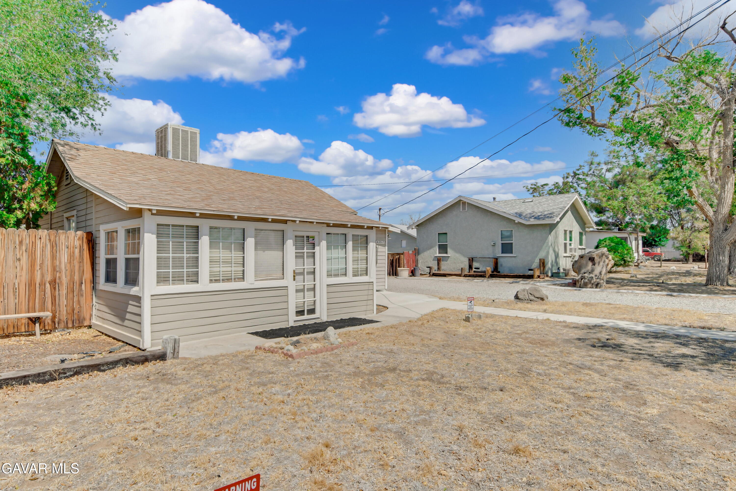 43517 7th Street East Lancaster, CA 93535 - Photo 28 of 47 a front view of a house with a yard