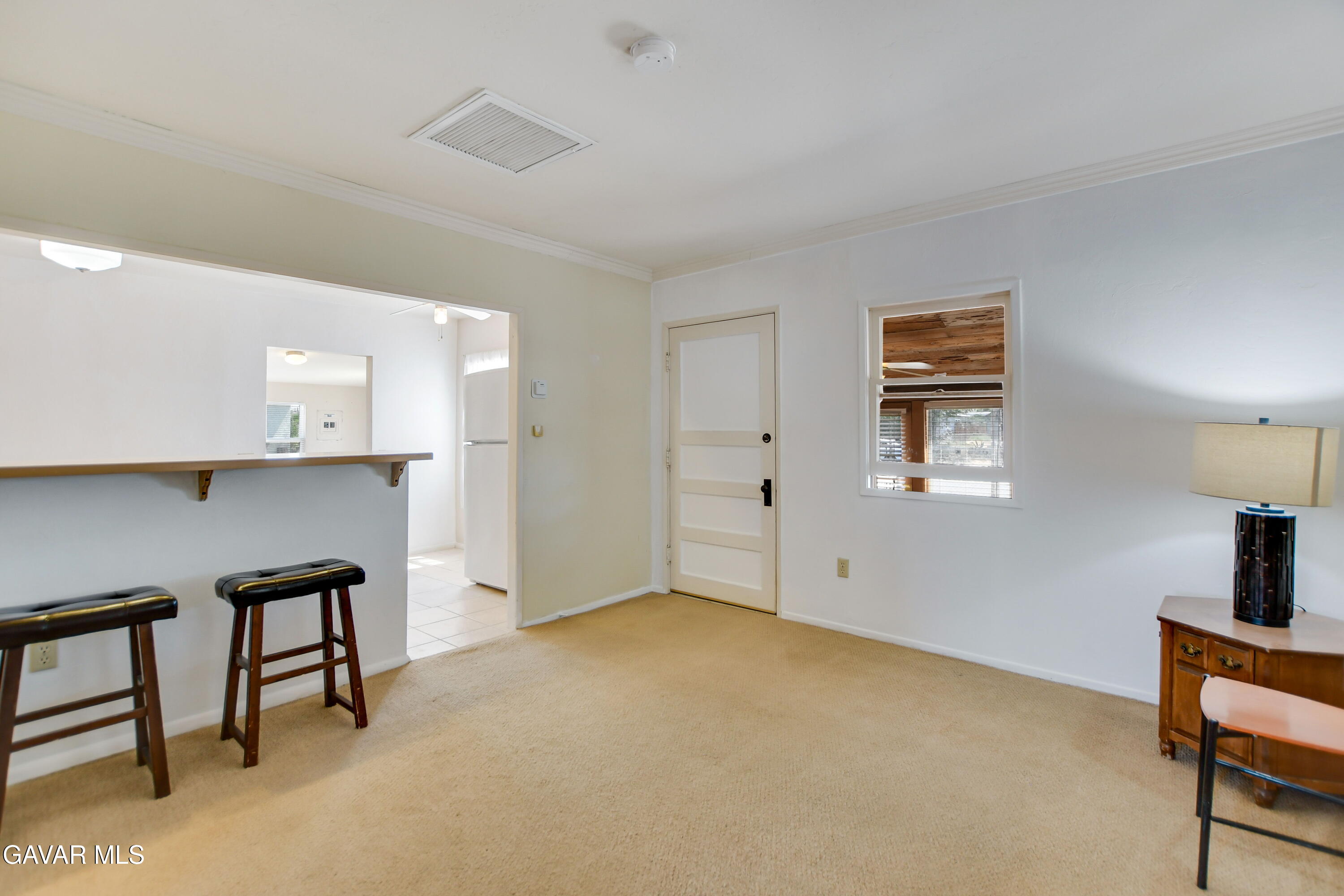43517 7th Street East Lancaster, CA 93535 - Photo 31 of 47 a view of empty room with a fireplace and potted plant