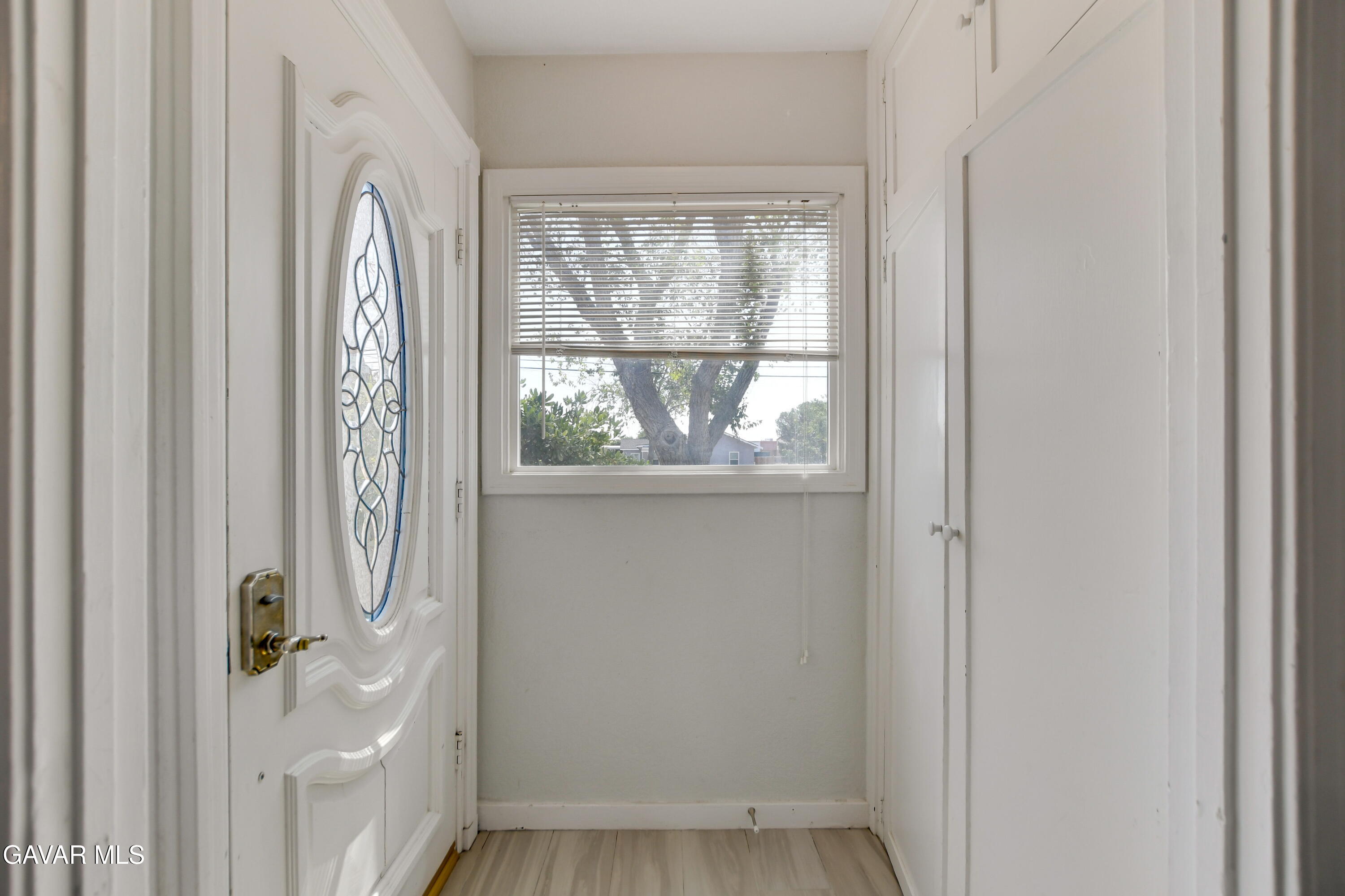 43517 7th Street East Lancaster, CA 93535 - Photo 4 of 47 a view of entryway with wooden floor and door
