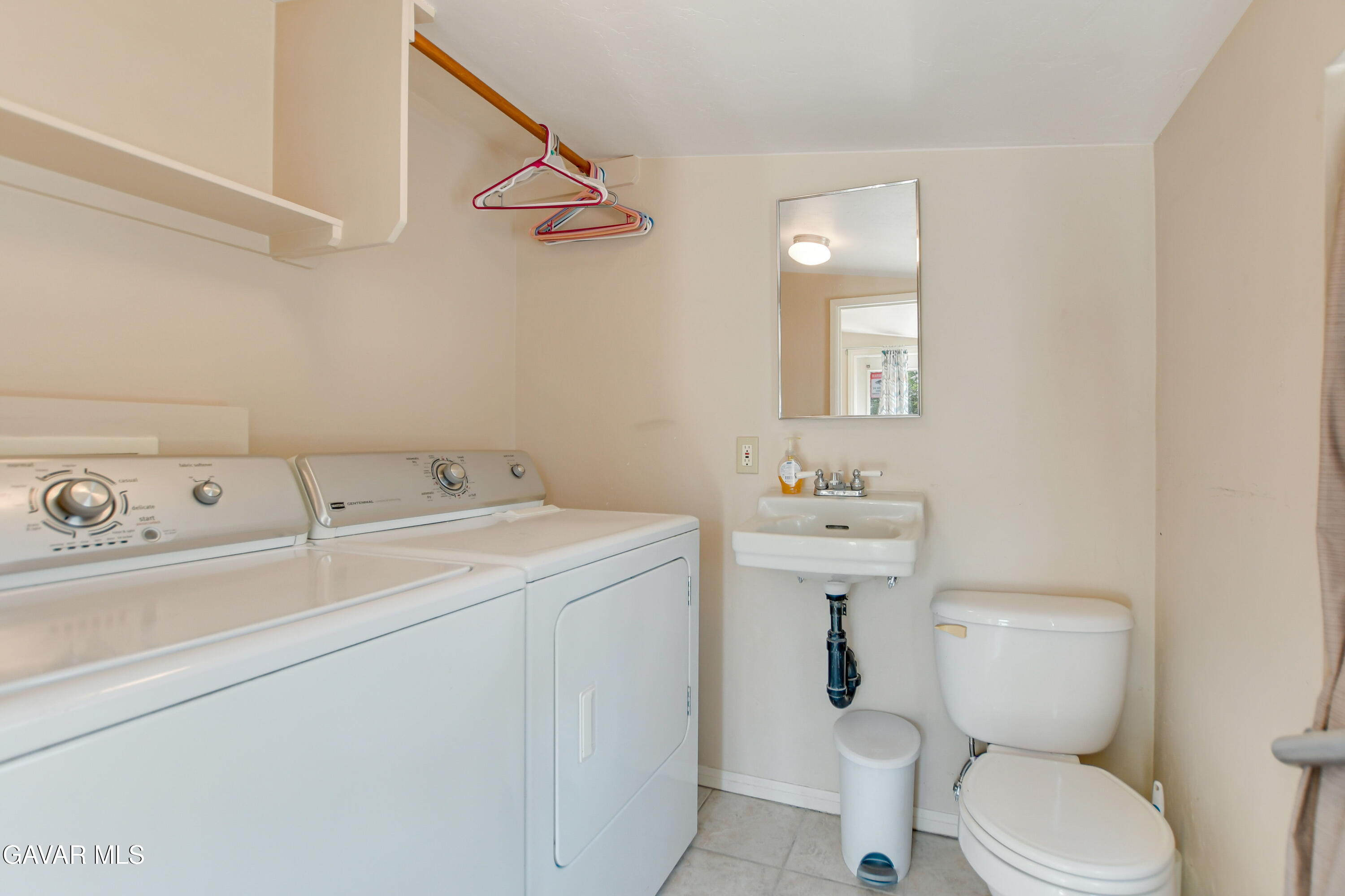 43517 7th Street East Lancaster, CA 93535 - Photo 41 of 47 a bathroom with a sink toilet and mirror