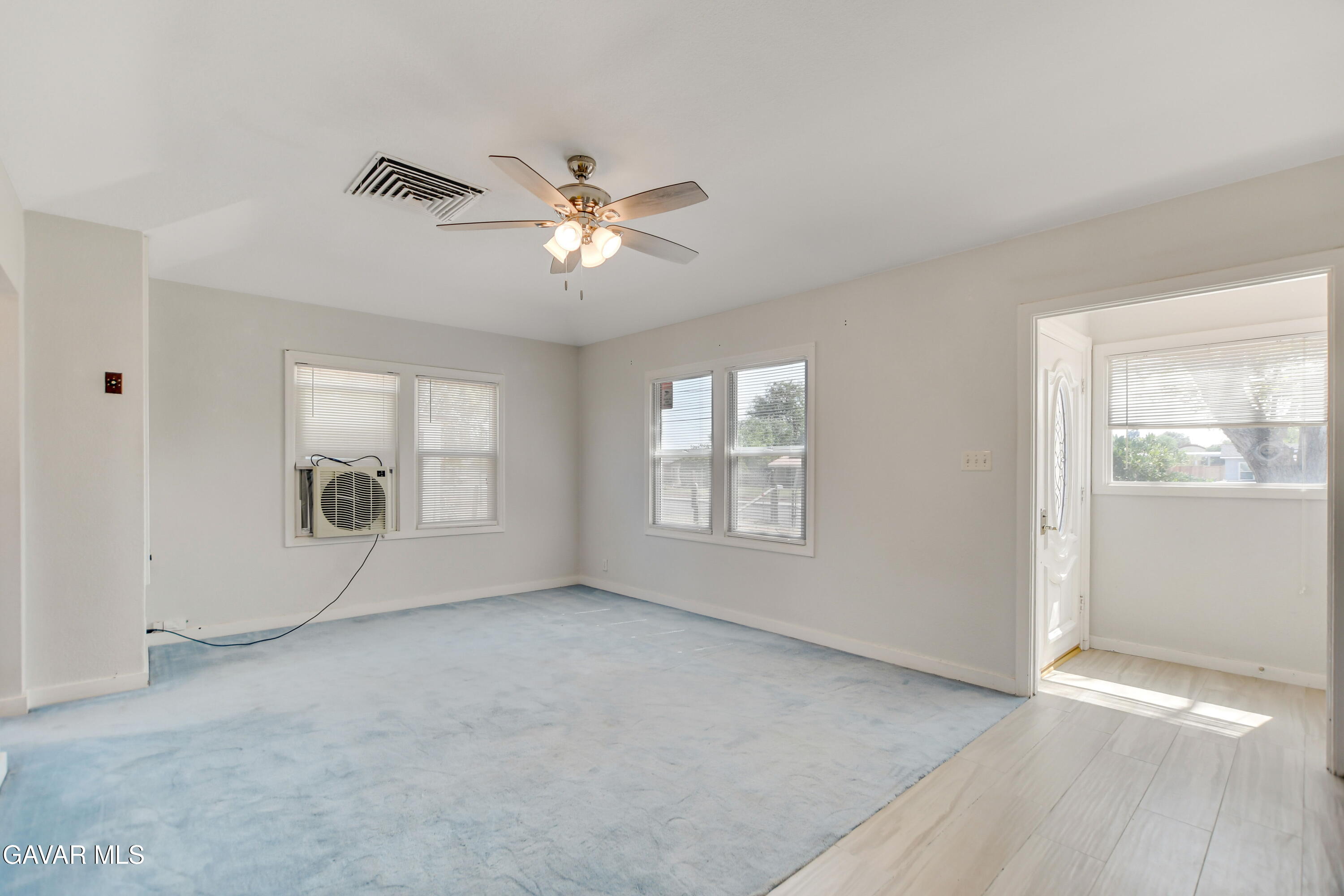 43517 7th Street East Lancaster, CA 93535 - Photo 8 of 47 a view of an empty room with a window